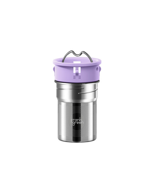 All | A stainless steel travel tumbler with a lavender purple lid and carrying handle, featuring the 'frank grill' logo on the lower front, set against a solid white background.