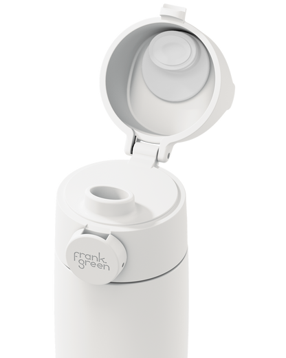 Close-up of a white Grip & Sip lid on a 12oz insulated bottle, with the sip cap flipped open to show the spout.