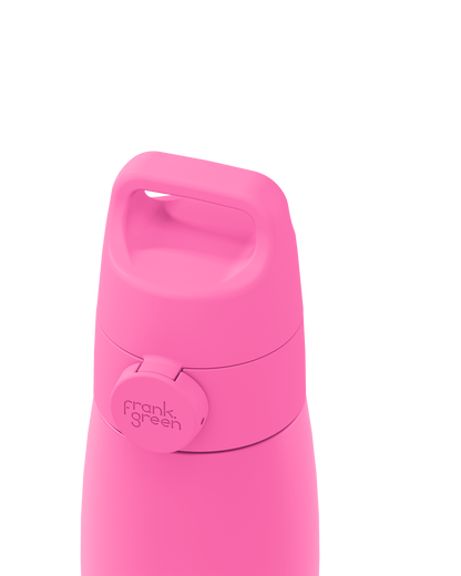 Close-up of a bright pink grip handle lid with a built-in carry handle and a circular 'frank green' logo tab, closed on the matching bottle against a plain white background.