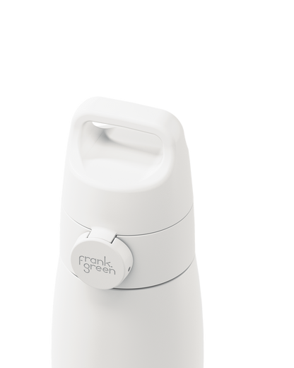 Close-up of a white grip handle lid with a built-in carry handle and a circular 'frank green' logo tab, closed on the matching bottle against a plain white background.