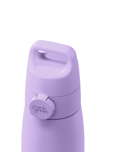 Close-up of a lavender purple grip handle lid with a built-in carry handle and a circular 'frank green' logo tab, closed on the matching bottle against a plain white background.