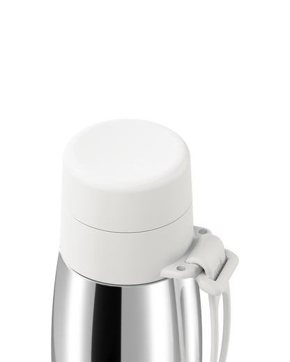 Close-up of a white thermal lid closed on a polished stainless steel 20oz insulated bottle, with the carry loop attached.