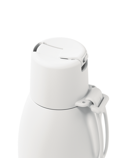 Close-up of a white vacuum-insulated bottle or thermos with a flip-top lid and side handle, shown on a clean white background.