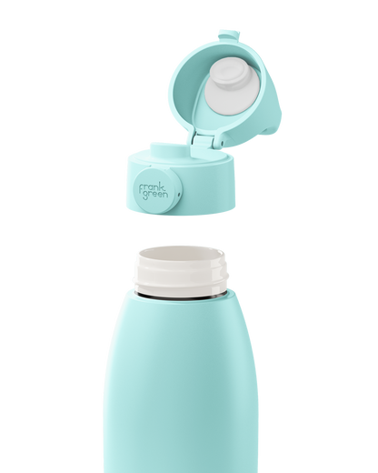 A light blue insulated bottle with its cap removed and floating above the bottle neck, showing the interior straw component. The cap has a round button with the brand name 'monk green' printed on it.