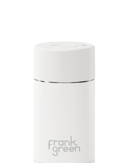 White reusable coffee cup with 'frank green' branding on a white background