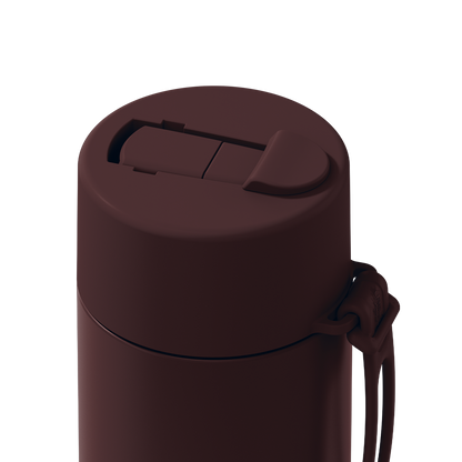 Close-up of a dark brown insulated bottle lid with a flip-top spill-proof design and a matching carrying loop, shown on a solid white background.