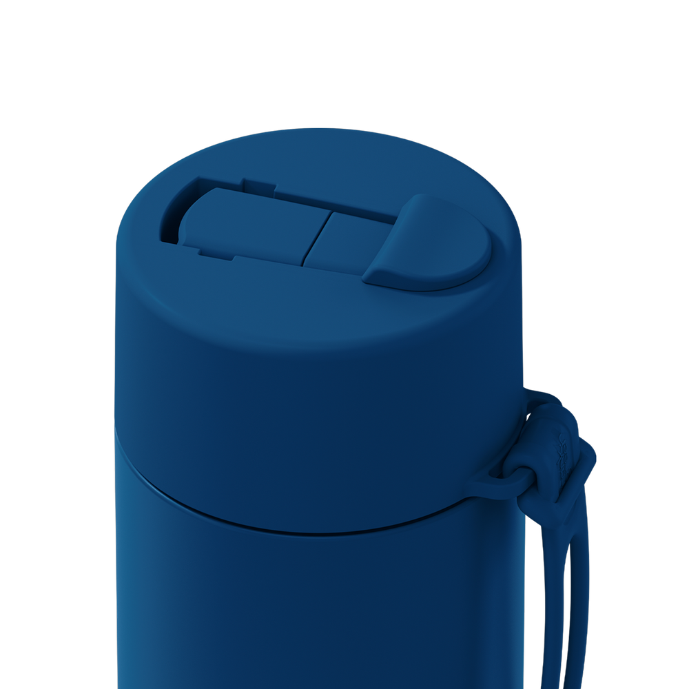 Close-up of a matte dark blue insulated tumbler with a flip-top lid and attached wrist strap on a plain white background.
