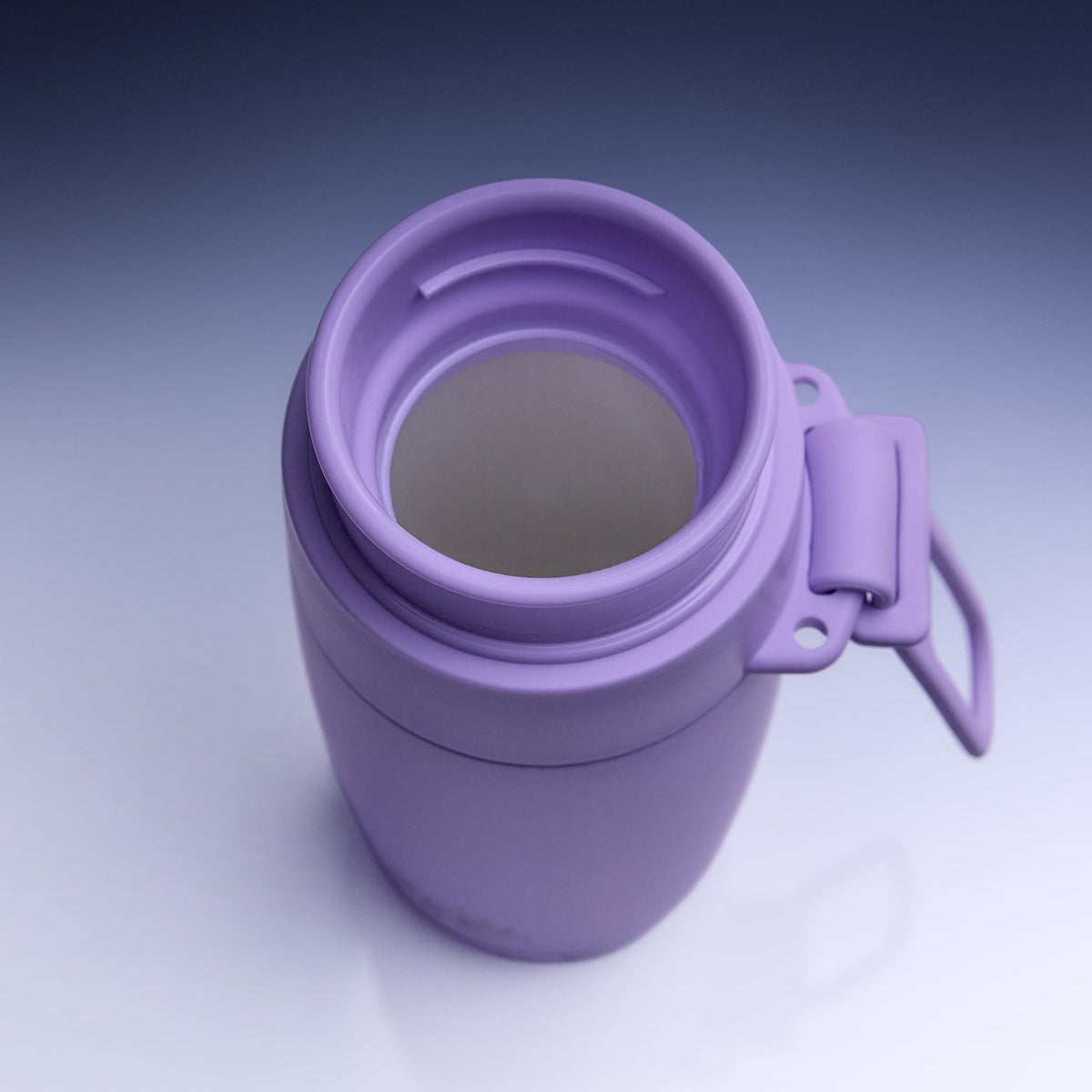 A purple insulated tumbler with a matching lid and carrying loop, shown from a top-down angle on a light gray gradient background.