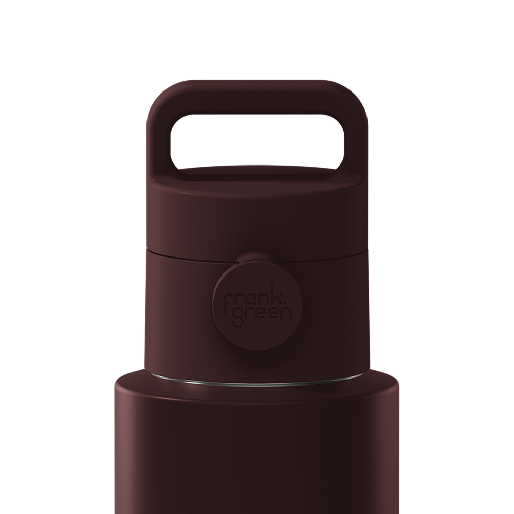 Close-up of a dark brown insulated bottle lid with a carry handle and a circular Frank Green logo, shown on a plain white background.